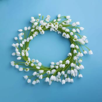 Wreath of white snowdrops on a blue background. Background for cards and banners. Copy space. Spring holiday background.