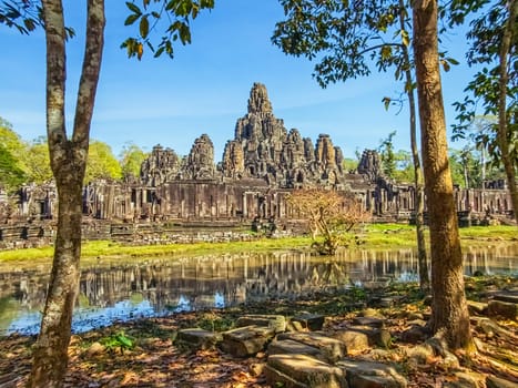 Bayon temple with stone faces of Buddha at Angkor Thom by day, Siem Reap, Cambodia