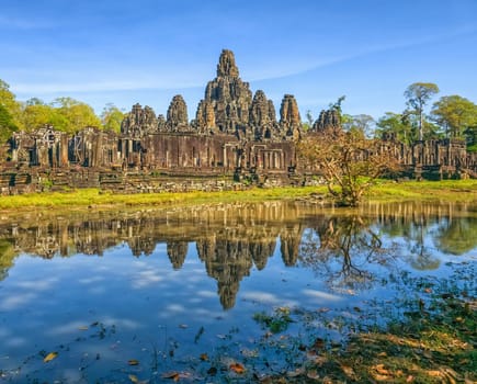 Bayon temple with stone faces of Buddha at Angkor Thom by day, Siem Reap, Cambodia