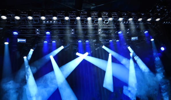 stage ceiling light, bright blue spotlights on a musical stage