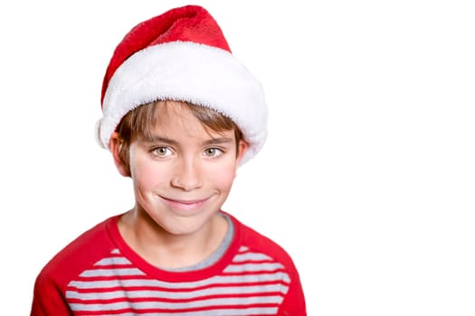 Smiling boy in Santa red hat isolated on white background. Christmas concept