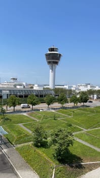 Airport control tower overseeing operations on a clear day