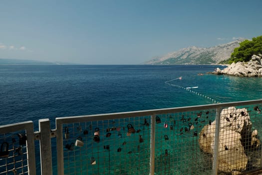 boardwalk over crystal clear water of Adriatic sea in Brela on Makarska Riviera, Dalmatia Croatia
