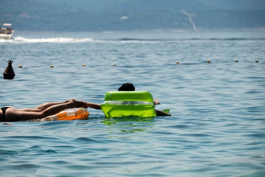 Snorkelist in crystal clear water of Adriatic sea in Brela on Makarska Riviera, Dalmatia Croatia