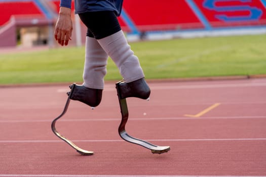 Side view of sport man athlete prosthesis legs stand and warm up legs on track in the stadium.