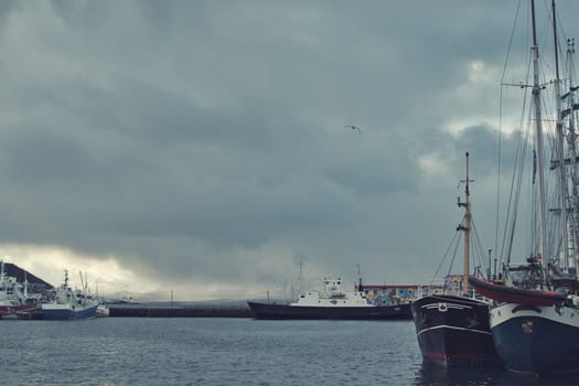 Ships in the harbor and on the quay of Tromso, Norway