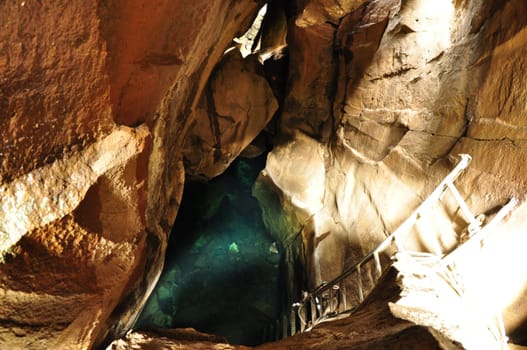 Blue-green hot spring water in Grjotagja cave in Iceland