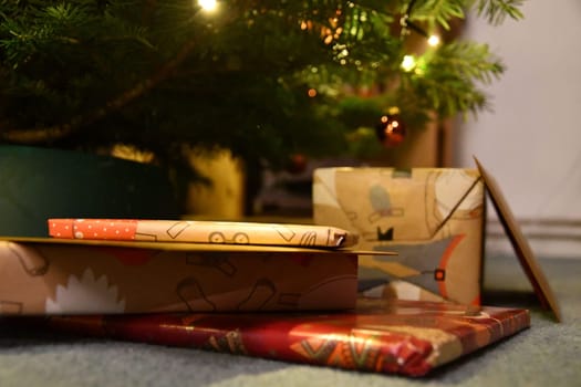 Beautifully wrapped gifts under a Christmas tree in Germany
