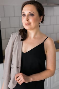 Portrait of a female online store business owner looking away and smiling. Woman doing her small business from home