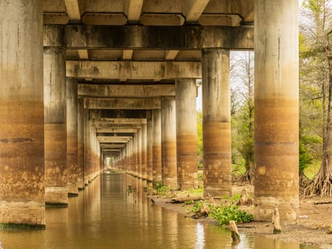 Receding pillars of the I-10 interstate bridge over the bayou of Atchafalaya basin near Baton Rouge Louisiana