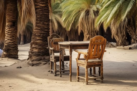 Rustic wooden table and chairs set amidst palm trees, offering a tranquil outdoor dining scene in a tropical oasis.