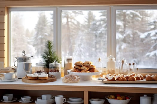 A photo of an hotel buffet with pastries ready for breakfast, coffee and christmas decoration, snow and winter outside