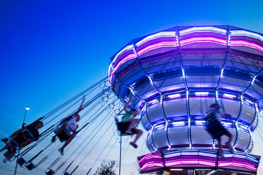 Photographic documentation of a Luna Park attraction taken in the evening 