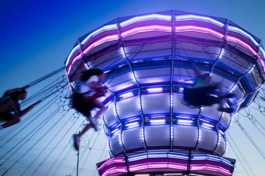 Photographic documentation of a Luna Park attraction taken in the evening 