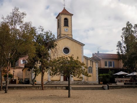 old church in main place of village of porquerolles island france, panorama landscape