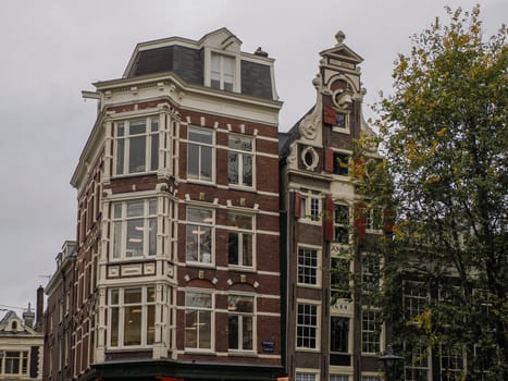 amsterdam ancient buildings over canals, netherlands