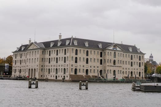 amsterdam: maritime museum and cityscape on rainy day