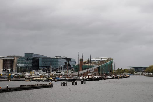 amsterdam: maritime museum and cityscape on rainy day