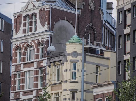 amsterdam ancient buildings over canals, netherlands