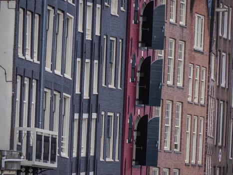 amsterdam ancient buildings over canals, netherlands