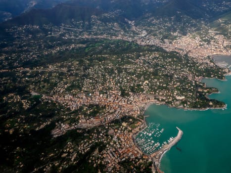 Rapallo Genoa Italy aerial view before landing to airport by airplane during a sea storm tempest hurricane