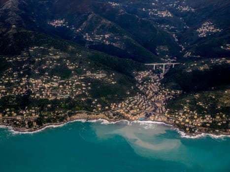 Bogliasco Genoa Italy aerial view before landing to airport by airplane during a sea storm tempest hurricane