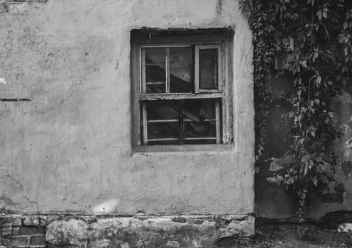 Front view of old building black and white concept photo. Vintage walls and window. Old city building photography. Street scene. High quality picture for wallpaper, travel blog.