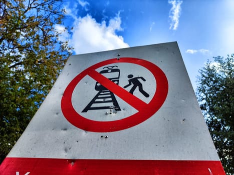 sign prohibiting crossing the railway track