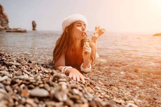 Woman travel sea. Happy tourist taking picture outdoors for memories. Woman traveler looks at the edge of the cliff on the sea bay of mountains, sharing travel adventure journey.