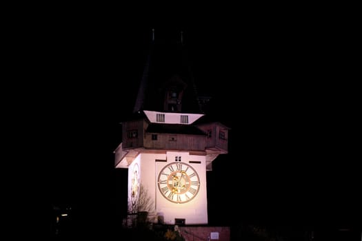 Night view of the clock tower in Graz Austria, in winter season