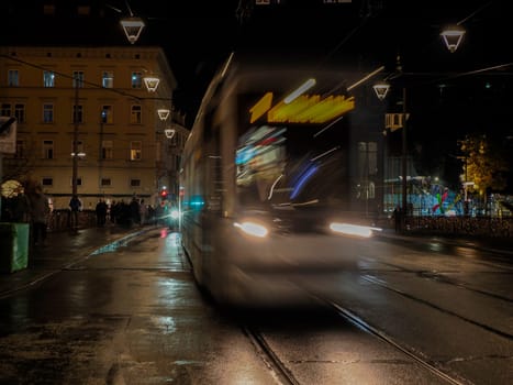A Night moving Trolley tram in graz austria tracks and cables in winter season