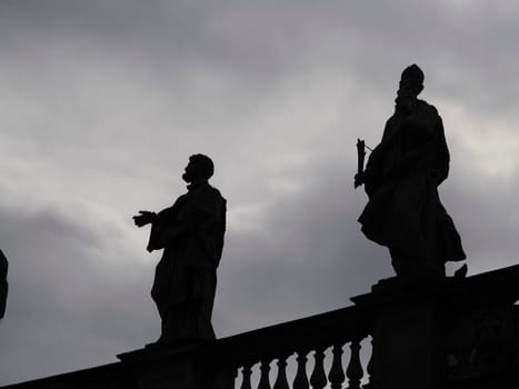 saint peter basilica rome silhouette detail of statue on columns roof