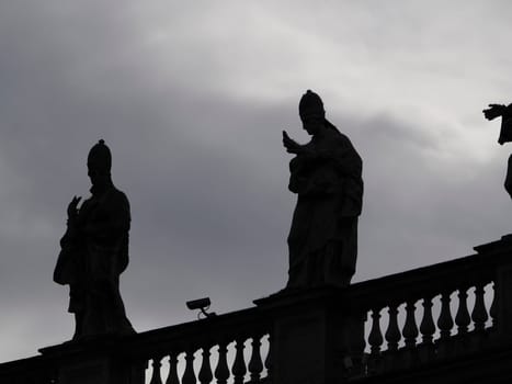saint peter basilica rome silhouette detail of statue on columns roof
