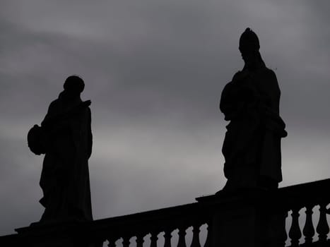 saint peter basilica rome silhouette detail of statue on columns roof