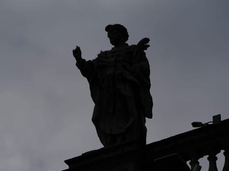 saint peter basilica rome silhouette detail of statue on columns roof