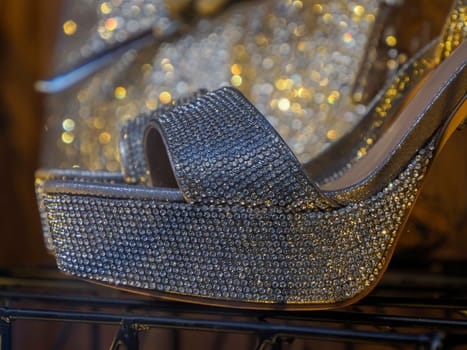 Woman diamond shoes in shop window detail