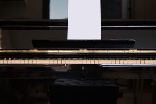 Still life shot. Cropped View of old vintage classical wooden piano in interior. Music. Arts, cultures and entertainment. Grand piano. Piano forte. Chord music instrument