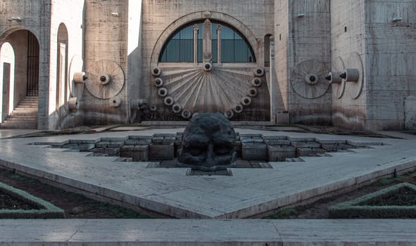 Yerevan cascade stairway with giant head in fountain. Armenian modern architecture photo. One of the sightseeing of Yerevan city. High quality picture for wallpaper, travel blog