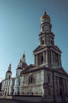 The old historical center of Kharkiv morning photo. Church architecture in summer, Ukraine. Urban city life. High quality picture for wallpaper, travel blog.