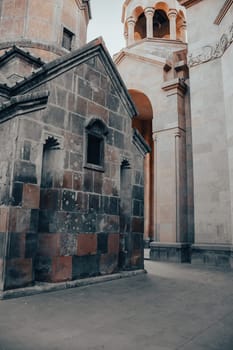 Old ancient church walls with spires cityscape concept photo. Street scene of Yerevan city. High quality picture for wallpaper