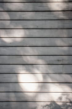 Close up wooden white wall with plank texture concept photo. Outdoor sunny old and beautiful barn background. High quality picture for wallpaper