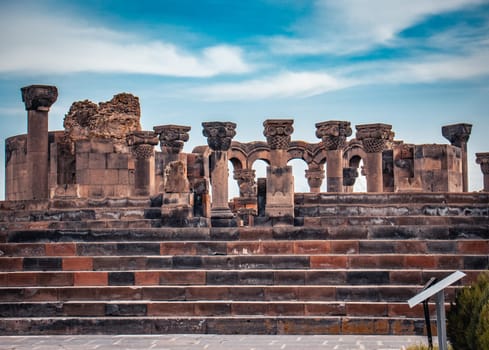 View of ancient column in Zvartnos temple in Armenia concept photo. Beautiful old temple scenery photography. High quality picture for magazine, article