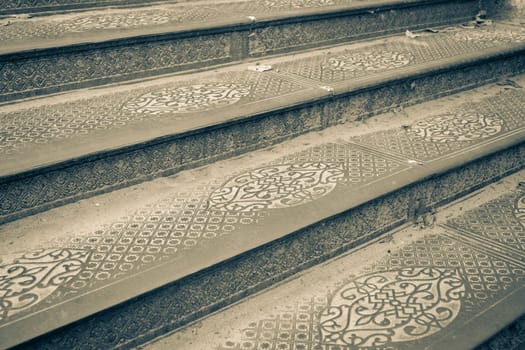 Ornate steel plate industrial staircase concept photo. Metal floor plate, steel staircase. District of European town. High quality picture for wallpaper. Suitable for background images and abstract illustrations.