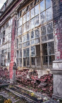 Old building with damaged windows concept photo. European towers. Architectural detail of ruined castle. Old doors, windows, balconies. Ukrainian moldings