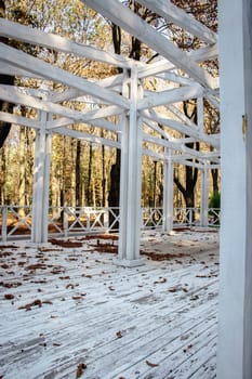 Close up view of the wooden gazebo house in park concept photo. Urban city life. Parkland of European town. High quality altanka picture for wallpaper