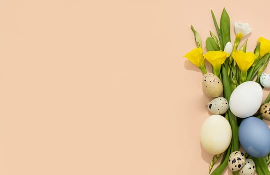 Trendy spring easter eggs compositon with painted egges and flowers and copy space for text