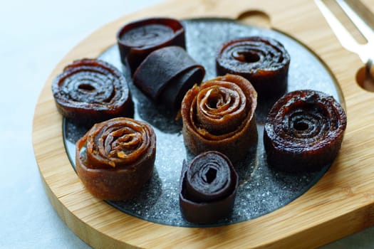 Homemade fruit leather close up. Healthy pastille. Natural vegan snack.