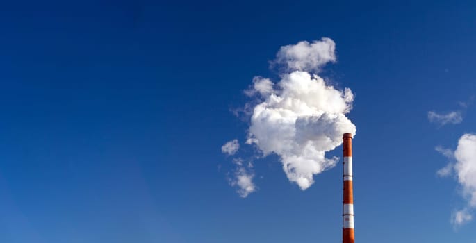 Factory pipe polluting air, smoke from chimneys. environmental problems, ecological theme. Banner copy space