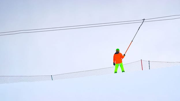 Person skiing down a slope, winter entertainment, winter time. Copy space