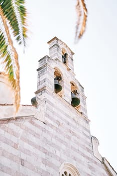 Bronze bells of the bell tower on the roof of the Church of the Holy Trinity. Budva, Montenegro. High quality photo